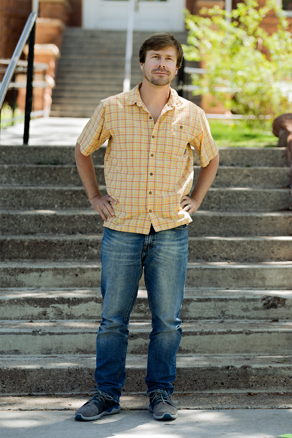 Callan Bentley standing in front of steps on the Northern Arizona University campus.