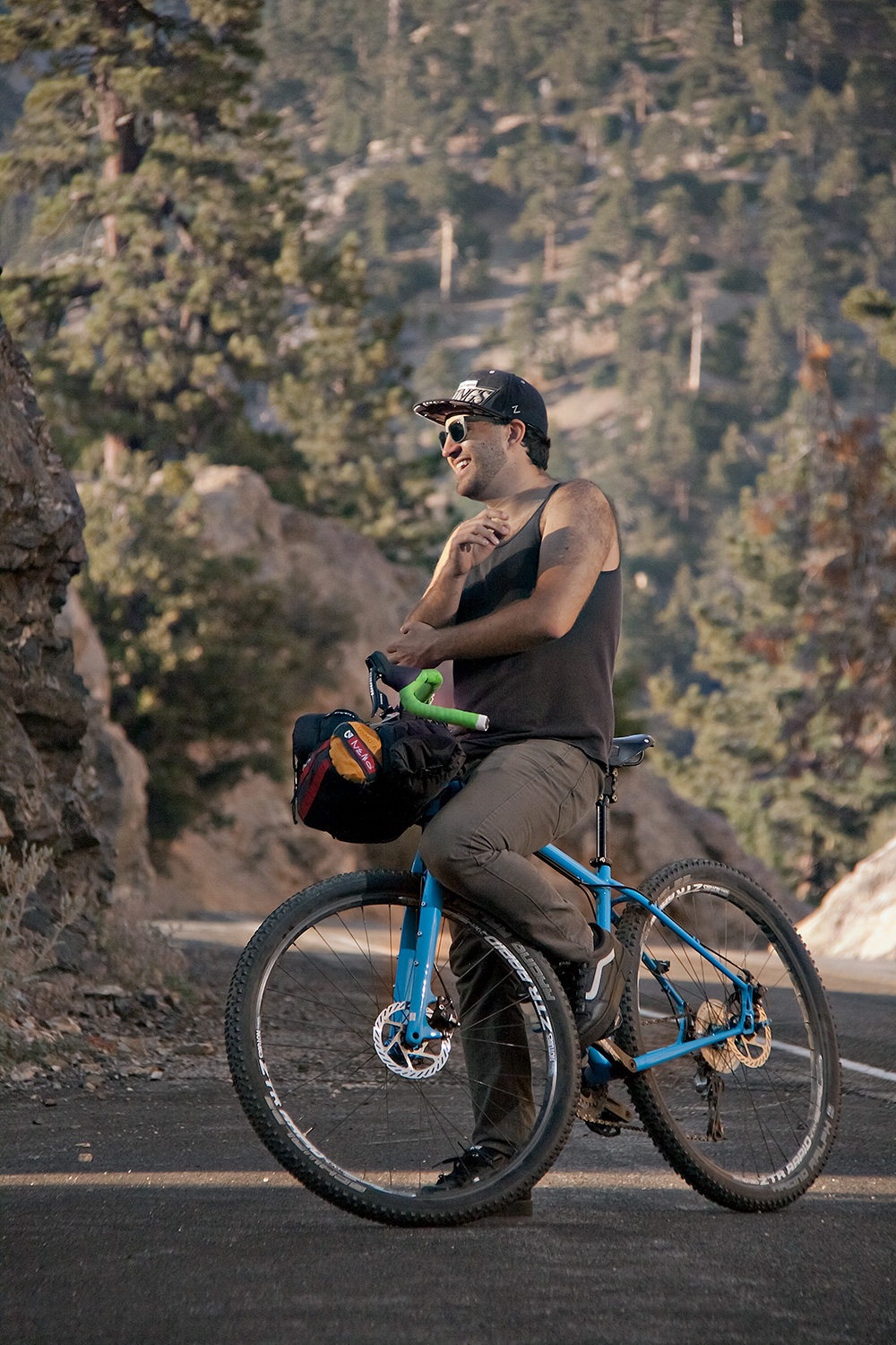 Benjamin Thomas Moss on his bike in the mountains.