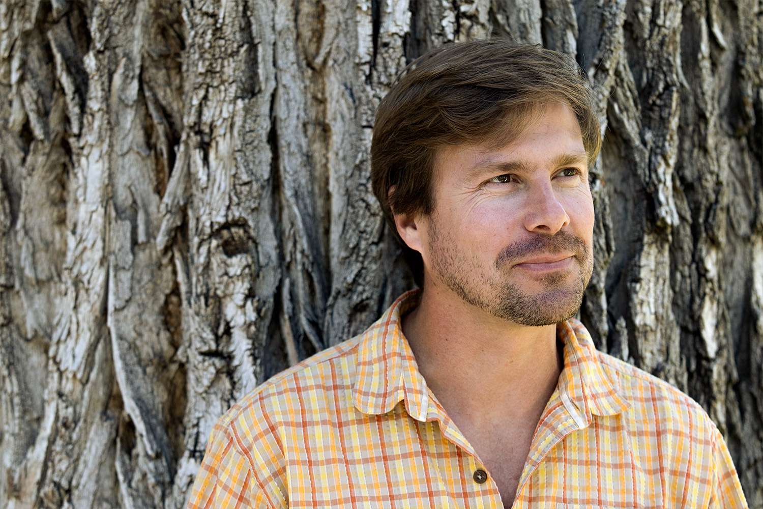 Callan Bentley standing in front of a native cottonwood.