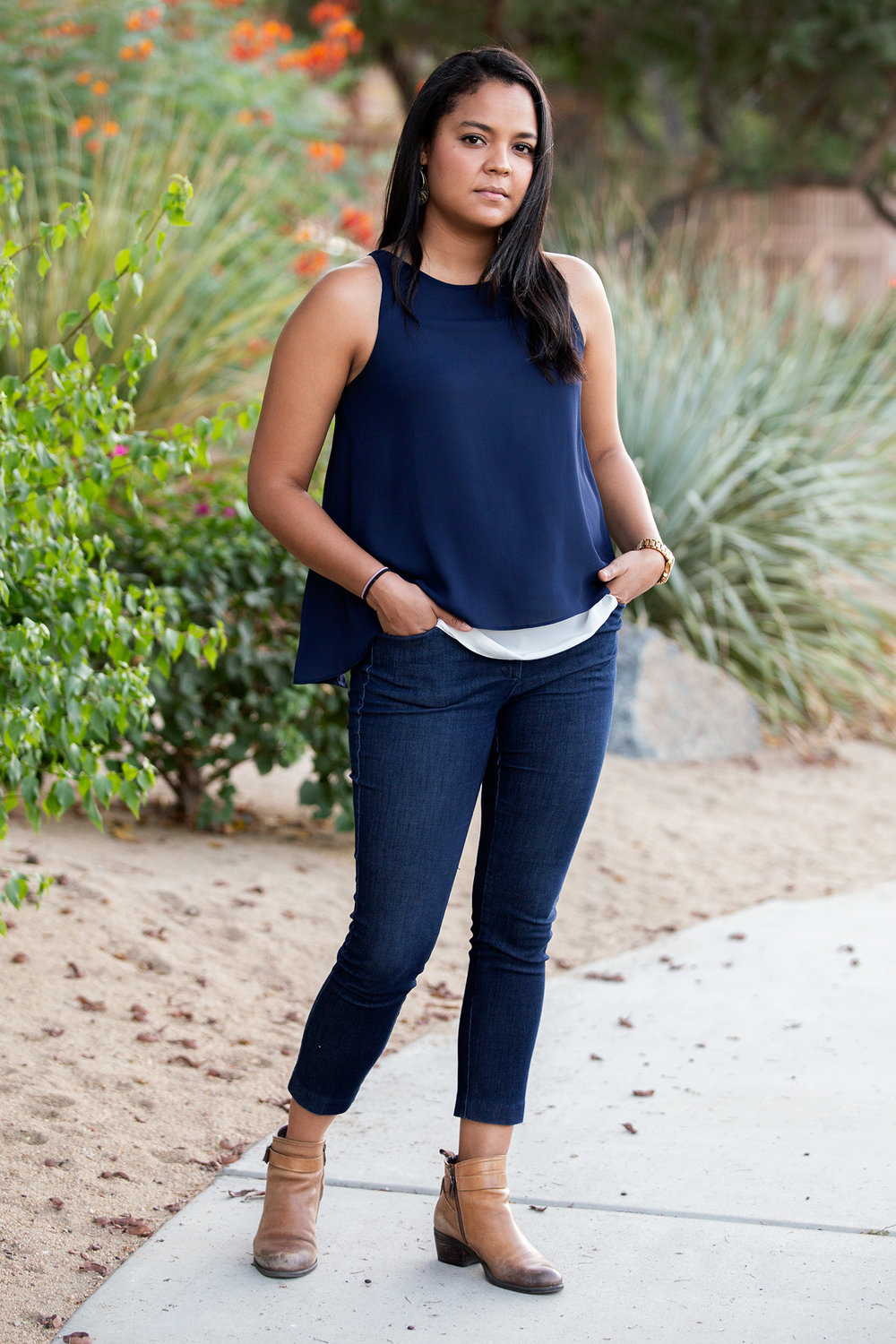 Edith Carolina Rojas standing in a desert garden walkway.