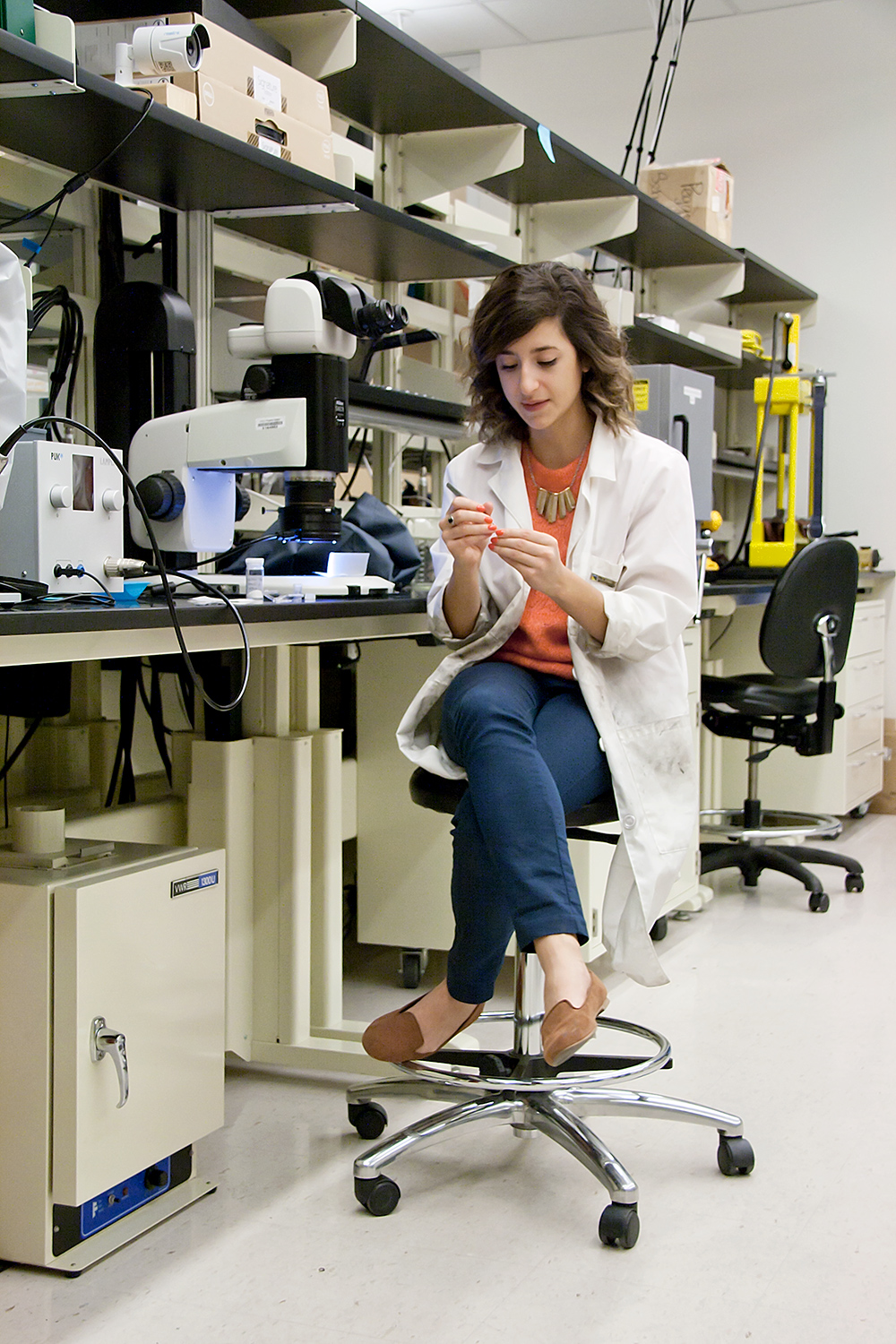 Hannah Shamloo investigating a miniscule sample in the EPIC laboratory.